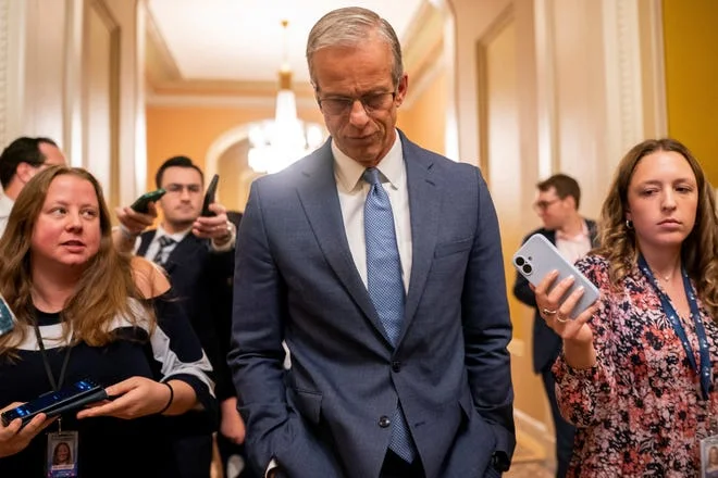 U.S. Senate Majority Leader John Thune (R-SD) walks to the Senate floor as Republican lawmakers struggle to pass U.S. President Donald Trump's sweeping spending and tax bill, on Capitol Hill in Washington, D.C., U.S., July 1, 2025. REUTERS/Nathan Howard