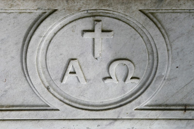 One version of the Alpha and Omega symbol on a headstone.