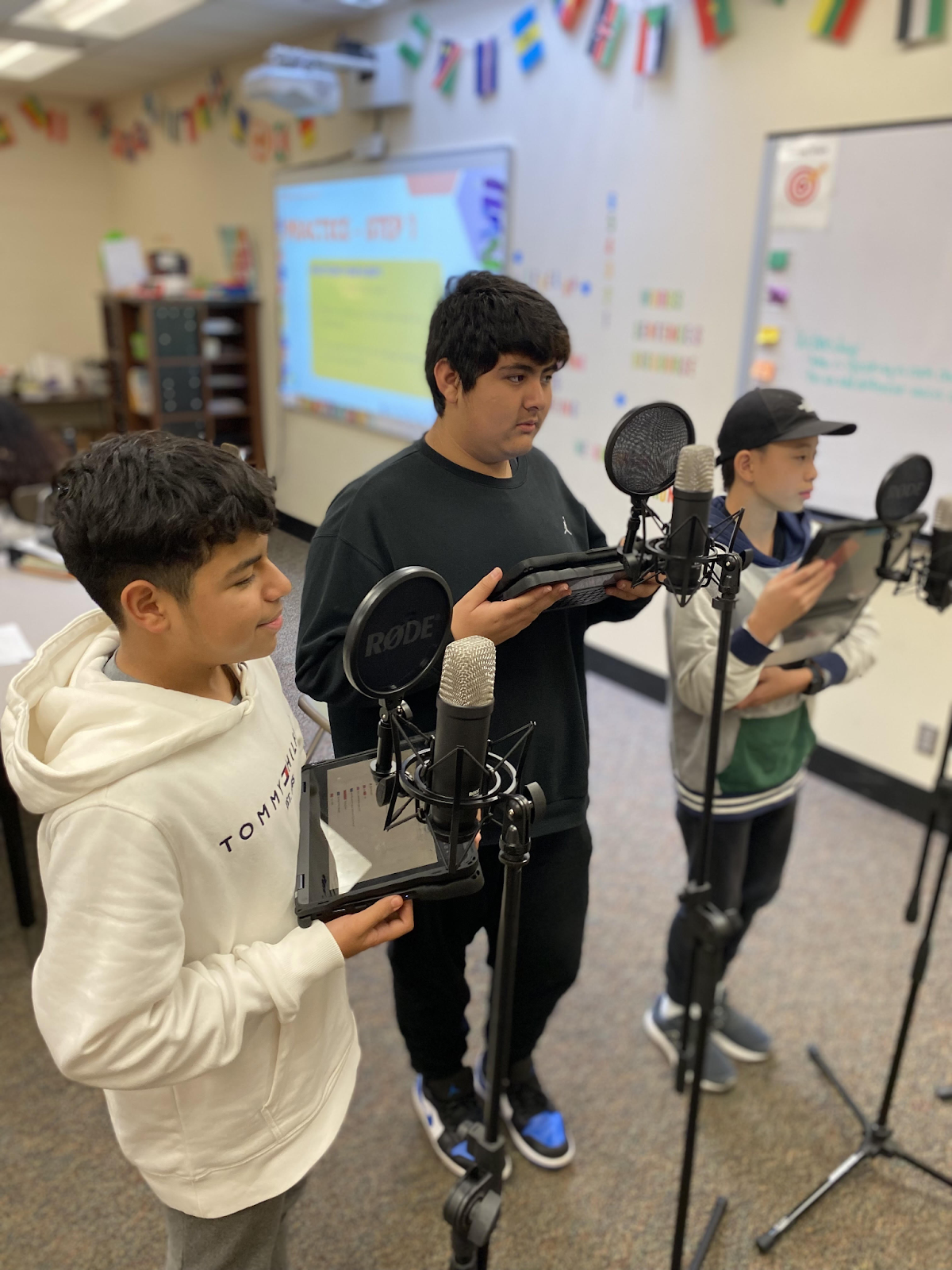 8th graders Angel Villanueva Morales, Angel Rodriguez and Kyota Yamagata recording their podcast