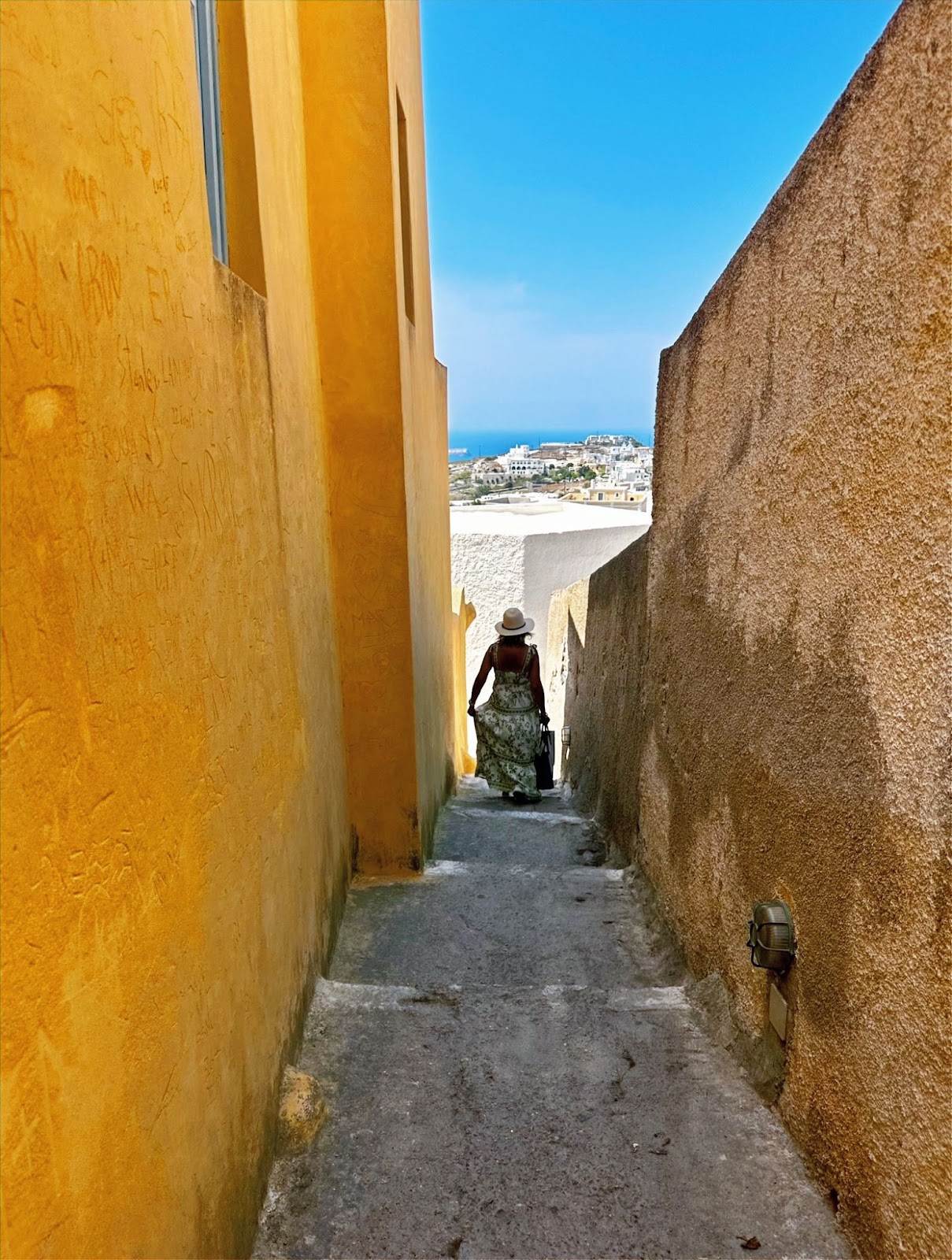 Santorini’s Caldera and Whitewashed Villages, view between buildings