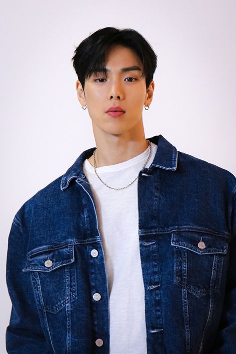 This contain MONSTA X Shownu  wearing a denim jacket and white t - shirt