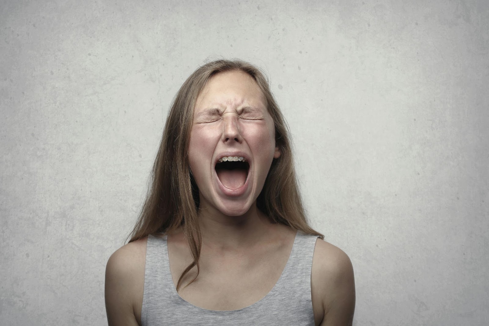 A frustrated woman screaming