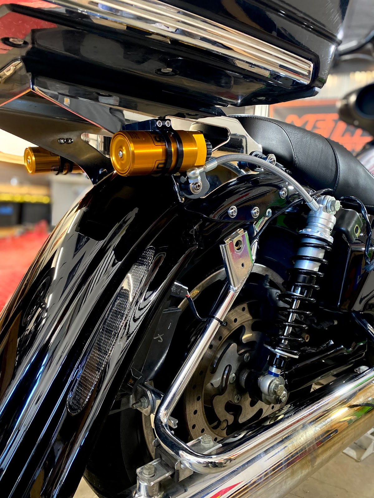 A pair of Ohlins 13 inch STX36 Remote Reservoir Shocks on the back of a 2009 Harley Davidson Street Glide