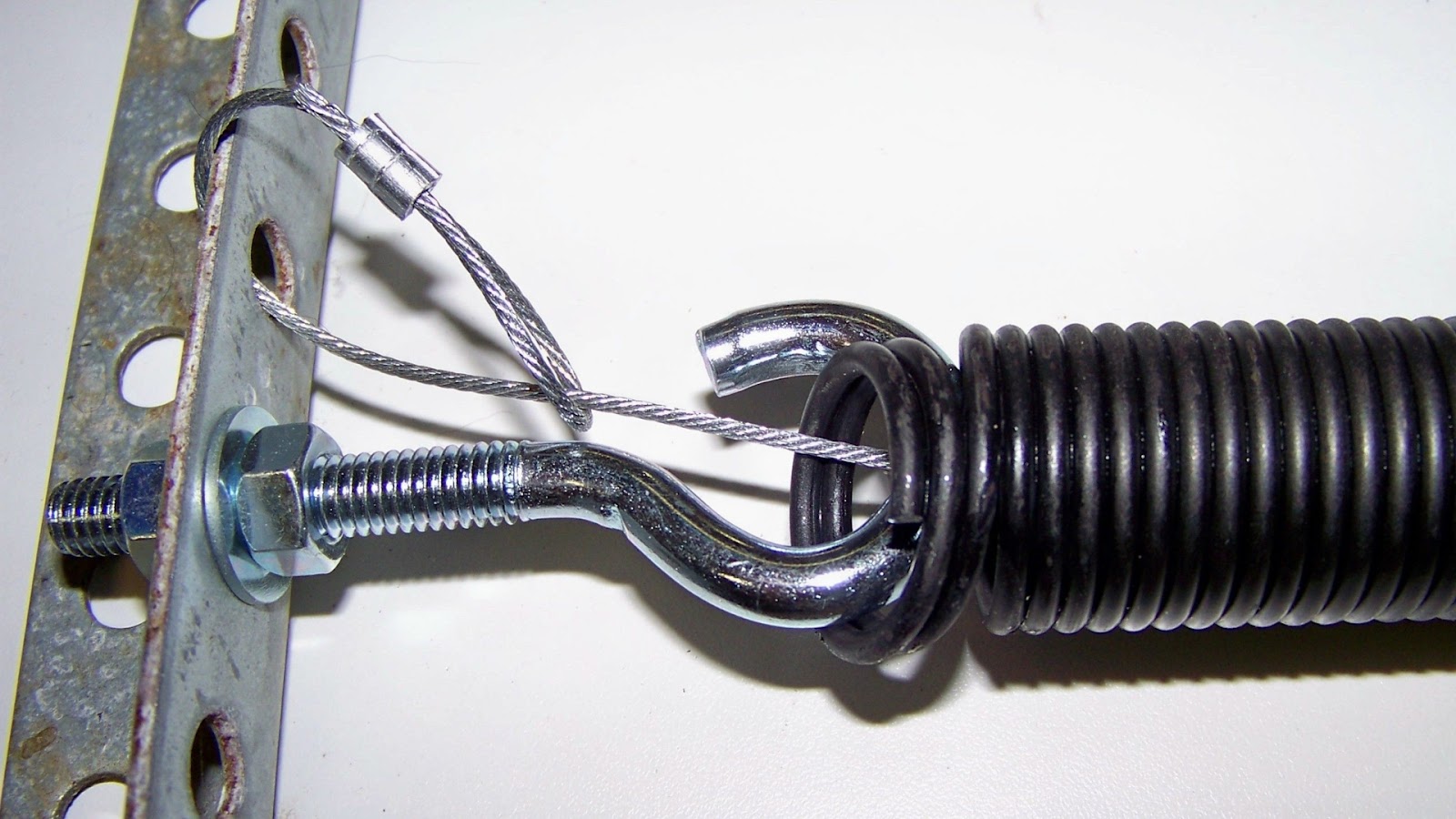 A new garage door spring and cable suspension system.