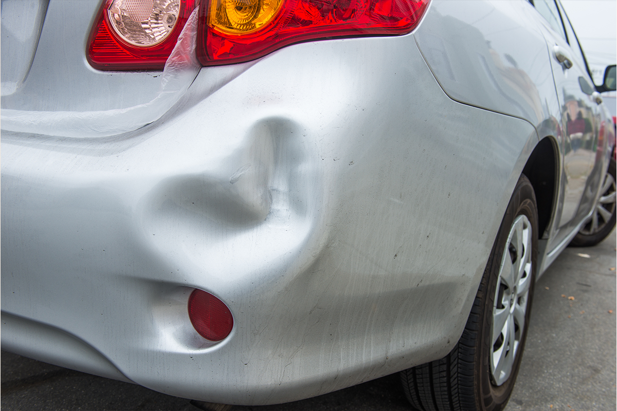 car rear bumper dent