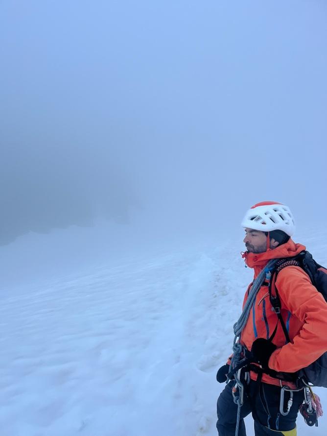 A person wearing a helmet and a backpackAI-generated content may be incorrect.