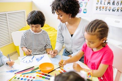 Free Boy and Girl Doing Painting Stock Photo