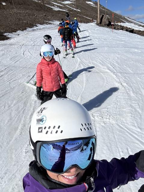 A group of people on snow skis
AI-generated content may be incorrect.