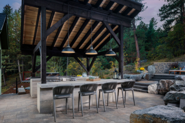 ways to create your dream outdoor kitchen pendant lighting over bar and barstools custom built michigan