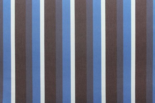 A close up of Sunbrella fabric in stripes of blue and white.