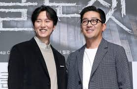 This contains an image of  Ha Jung Woo's with Kim Nam Gil