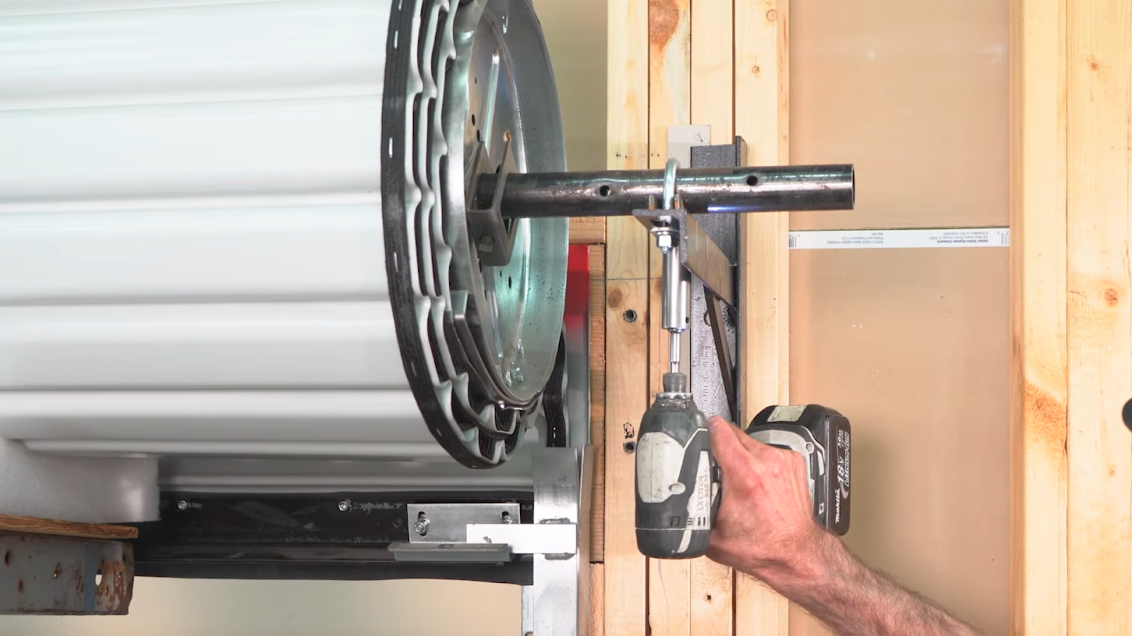 how to install garage door rollers