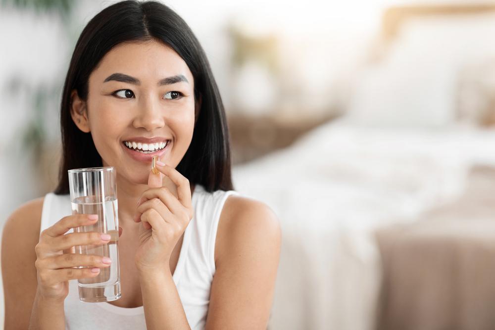 Lady taking her vitamin