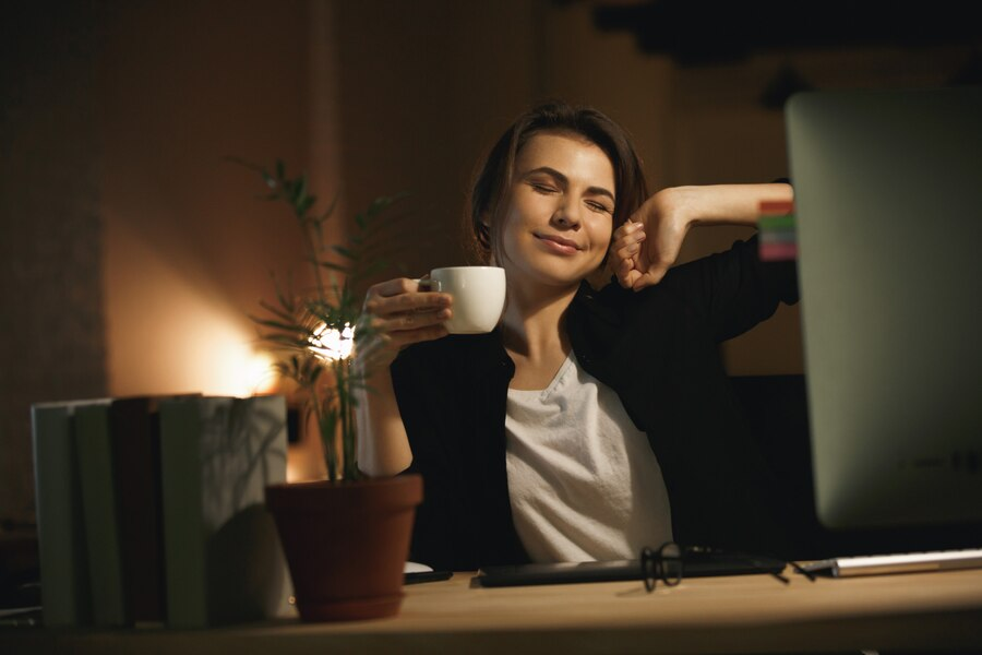 A girl stretching on her chair with smile 