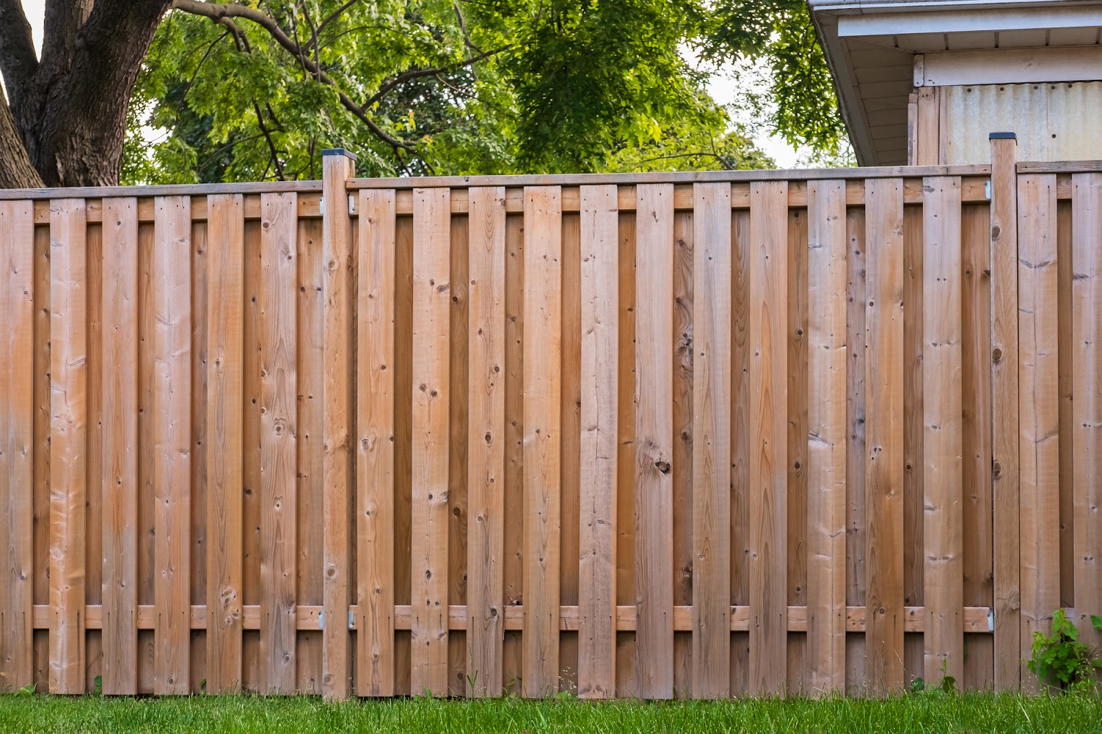 Nice new wooden fence around house