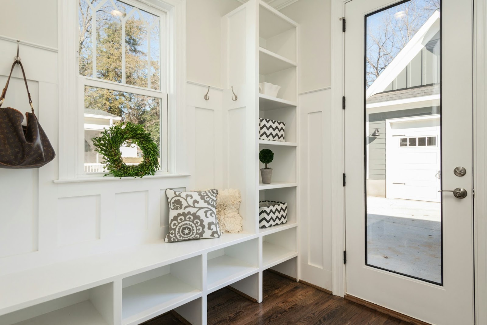 This image depicts an exterior door with a glass pane, featuring a sleek and modern design, allowing natural light to enter while providing a stylish entryway.