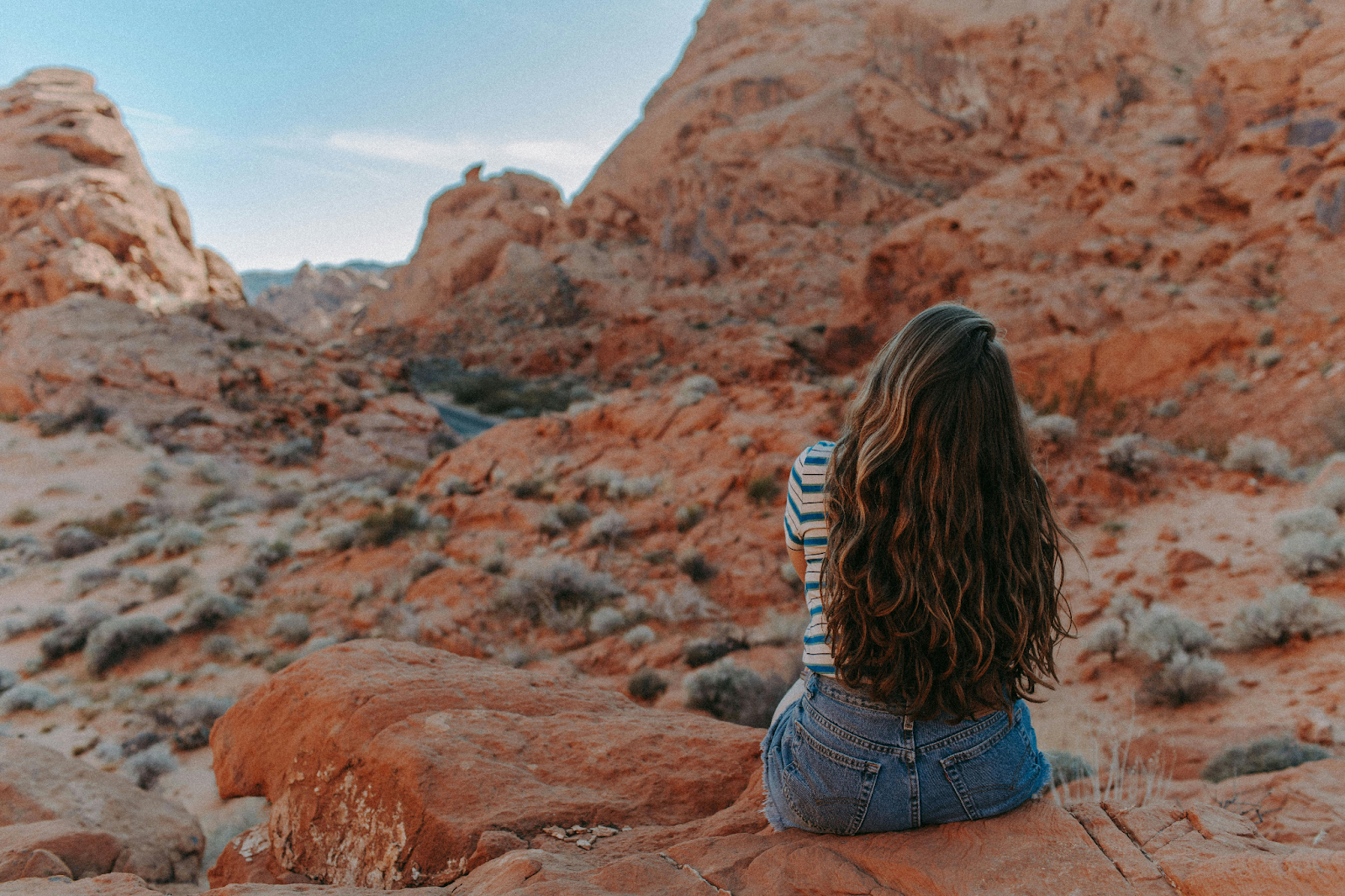 A woman taking a break on a walk in Nevada 