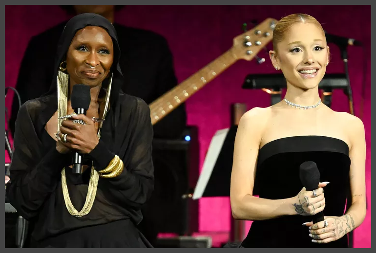 A person holding a microphone and a person holding a microphone

Description automatically generated