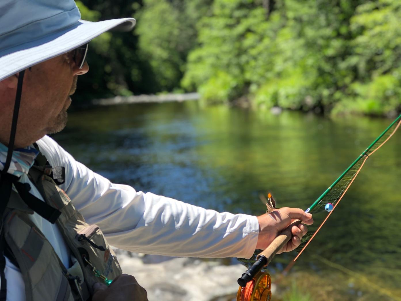 A person fishing on a river

AI-generated content may be incorrect.