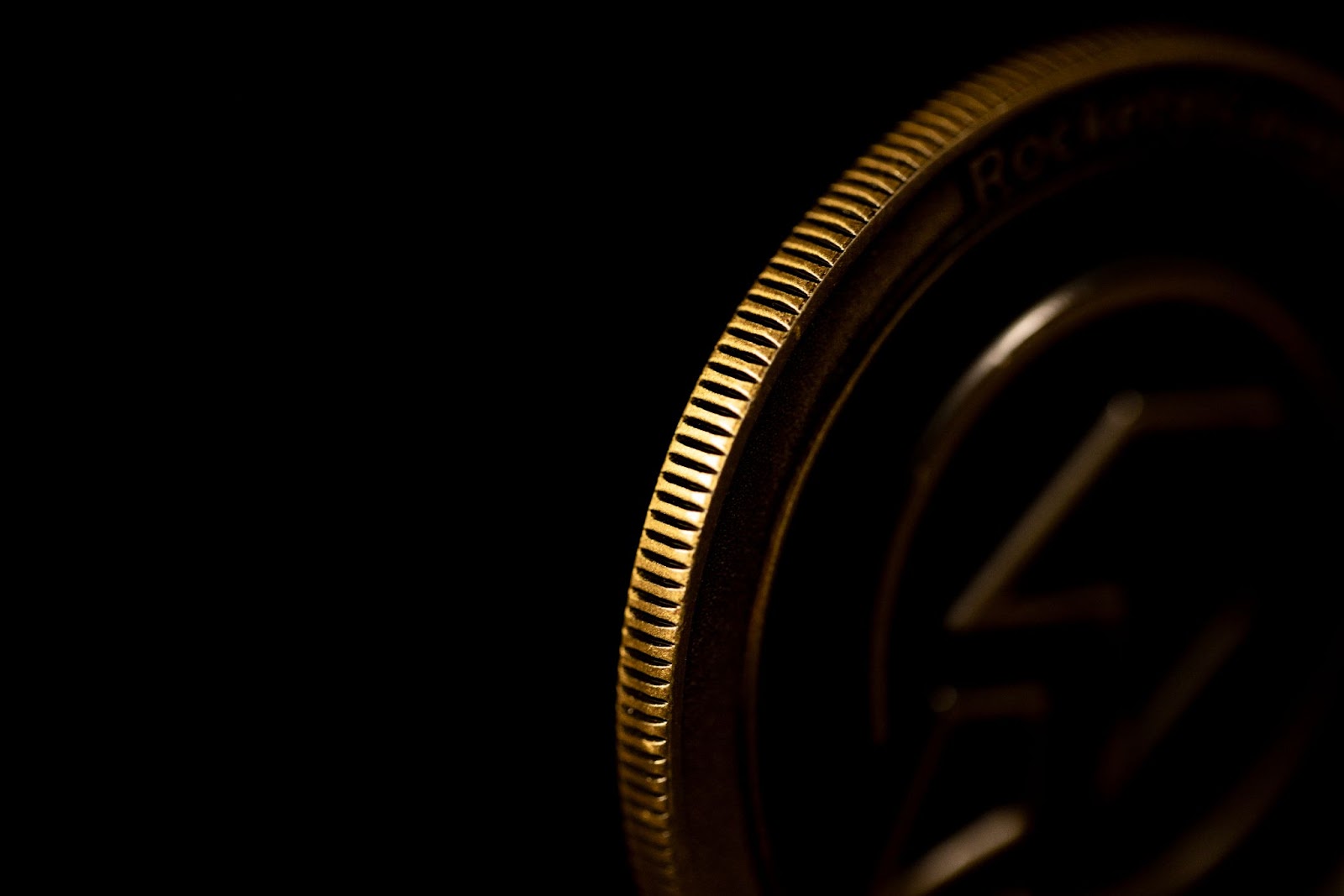 Close-up of a reeded challenge coin edge.