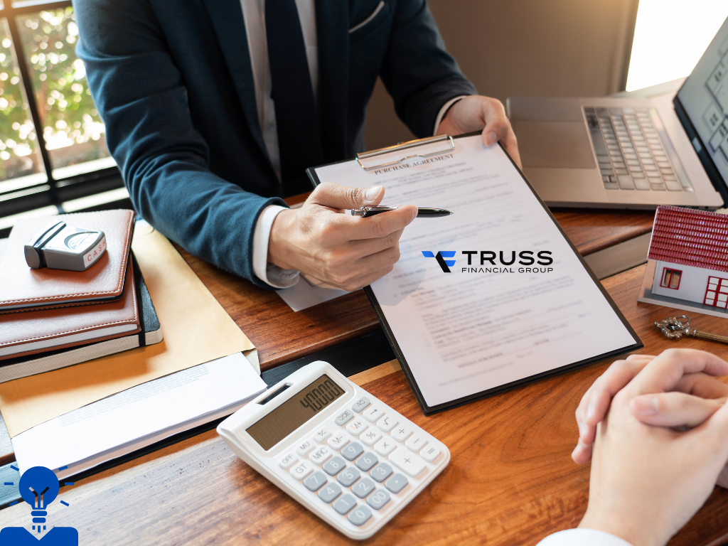 lender showing documents and calculations to the borrower for a mortgage