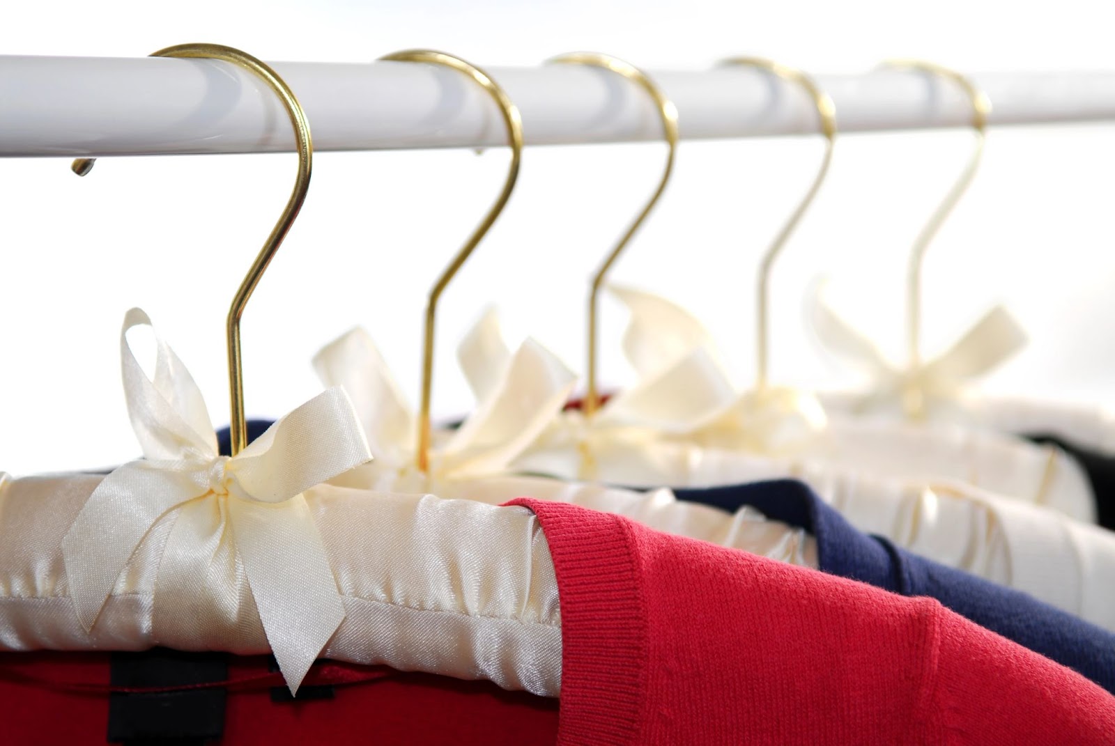 Hanging sweaters on padded hangers to avoid stretching