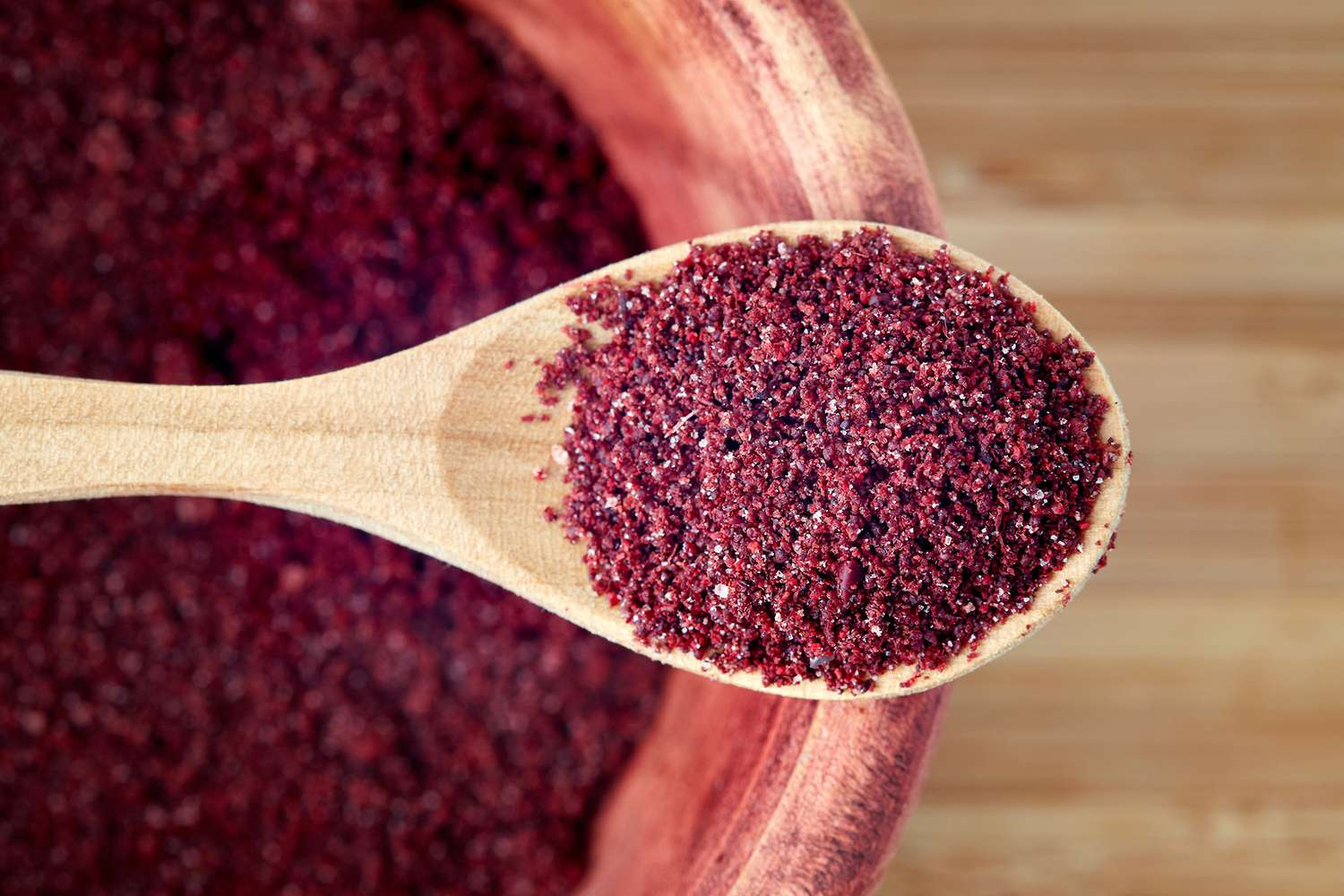 Sumac in a wooden spoon - (Credits Martha Stewart)