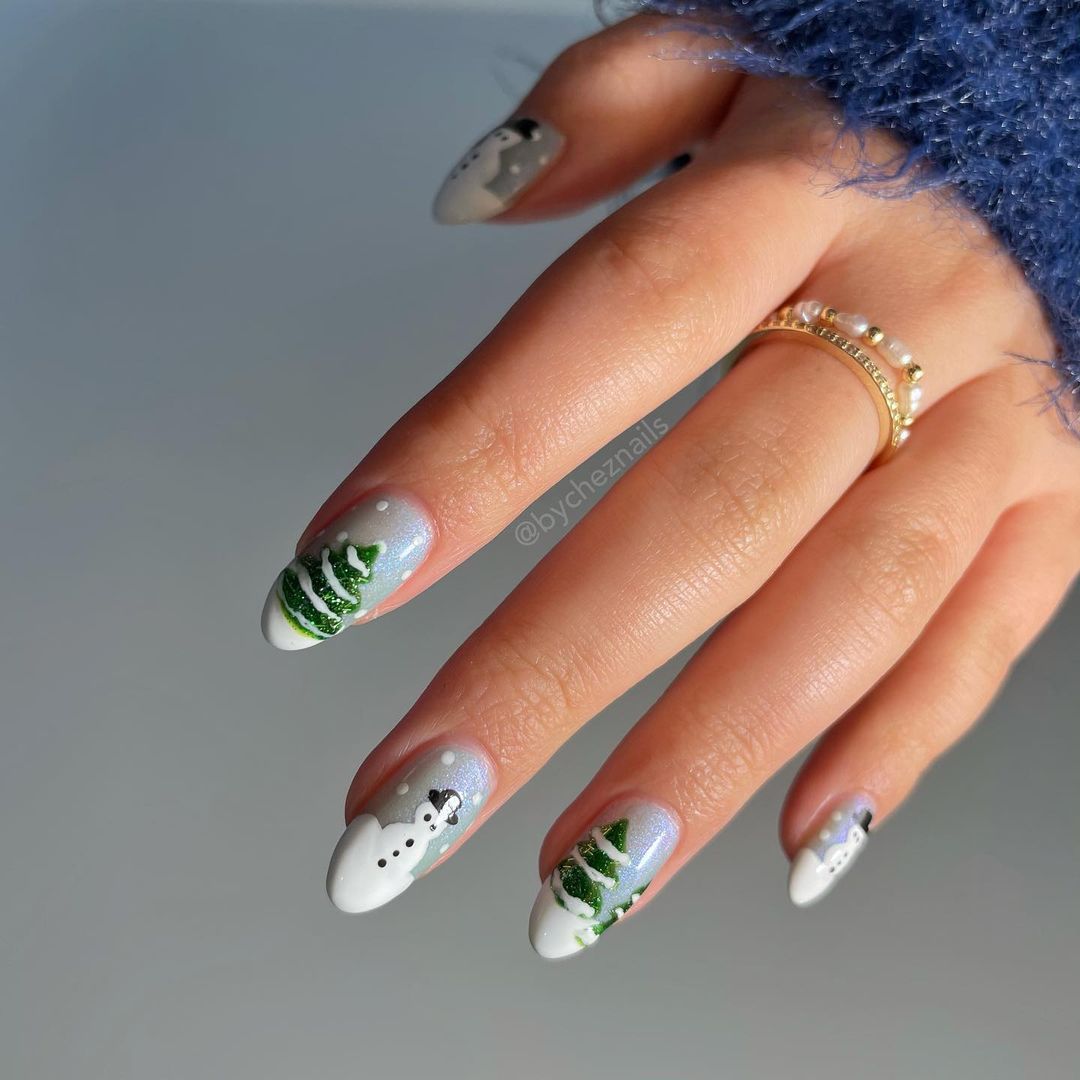 Close up of hands with blue winter nails having Snowman Smiles