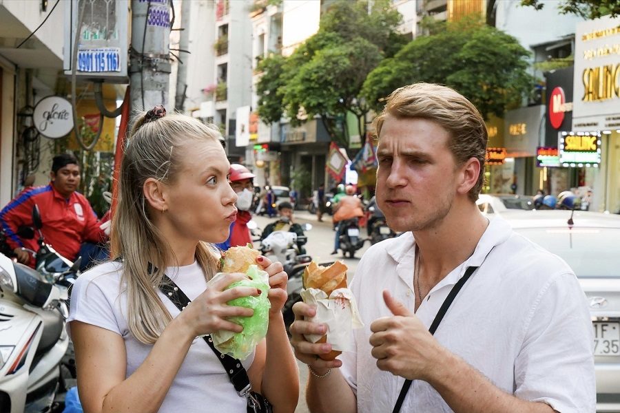 Tourists enjoy Banh Mi