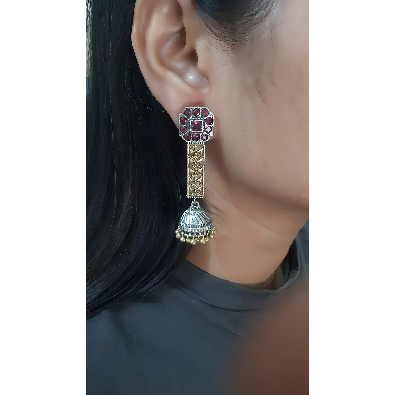 The Label DG Dual Tone Ethnic Long Jhumka Earring is wore by the girl in this image. 