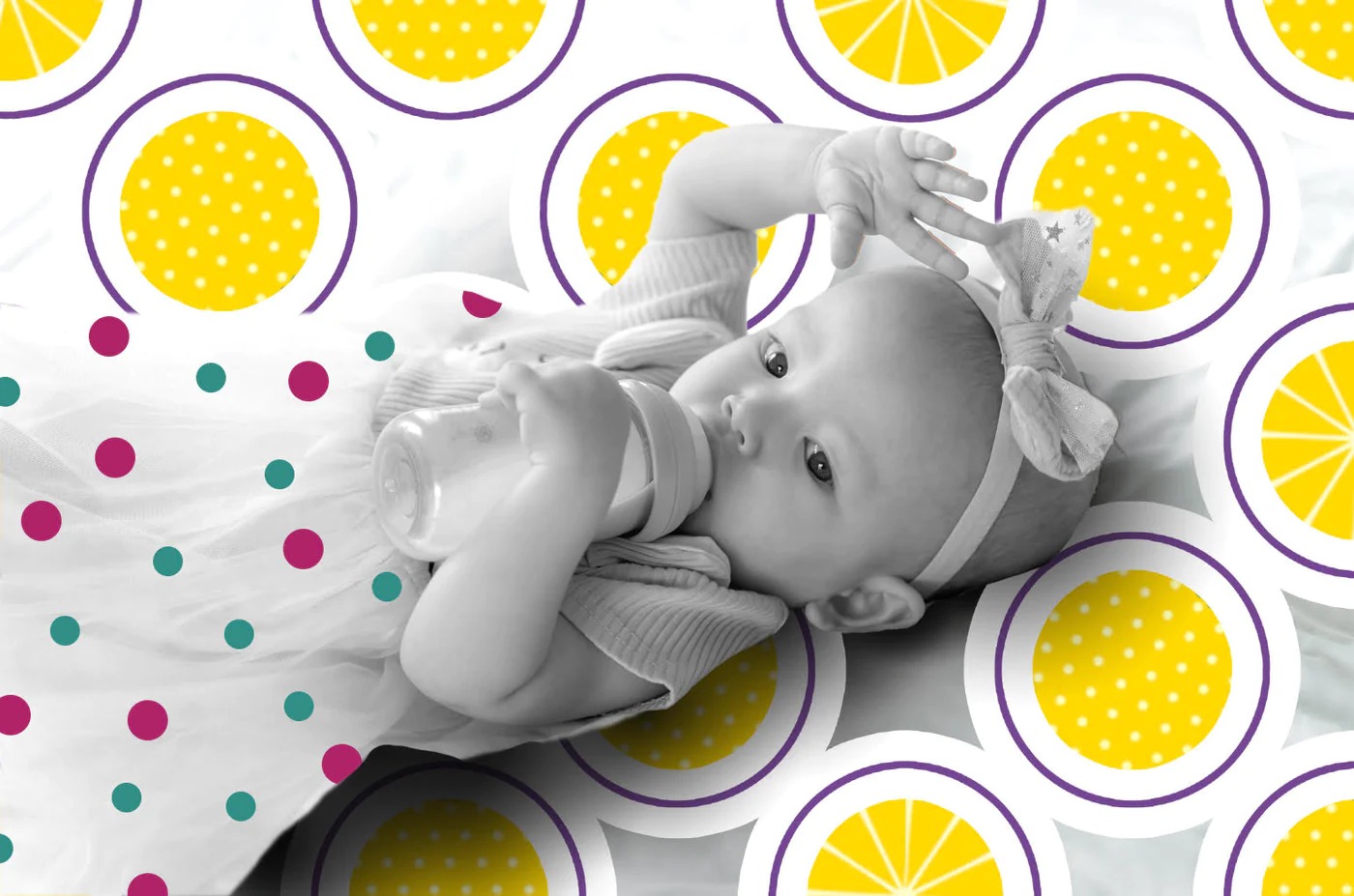 A baby girl lies on a bed covered in yellow polka dots, smiling and surrounded by soft blankets.