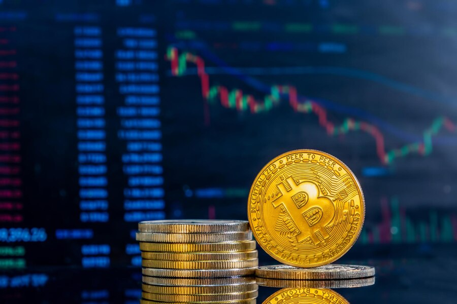 Golden Bitcoin coin and graphics on the background