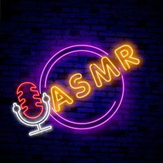 This contains an image of ASMR sign with the word on it in front of a brick wall