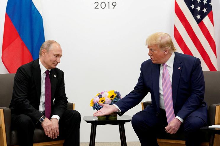 President Donald Trump gestures during a bilateral meeting with Russia's President Vladimir Putin at the G20 leaders summit in Osaka, Japan, June 28, 2019.