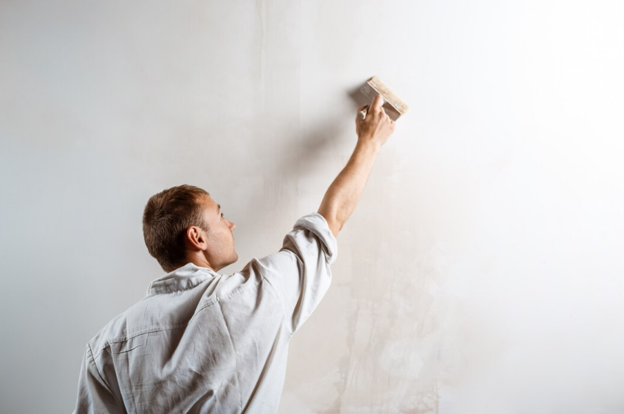 man preparing for wall plastering 