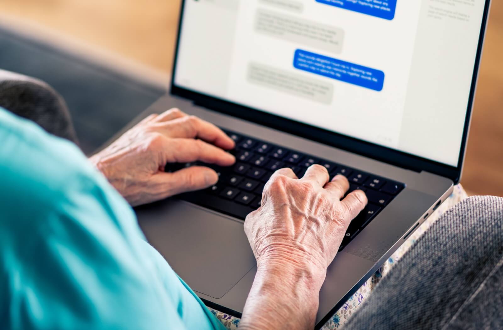 A close-up image of a senior chatting online with a prospective partner they met on an online dating website.