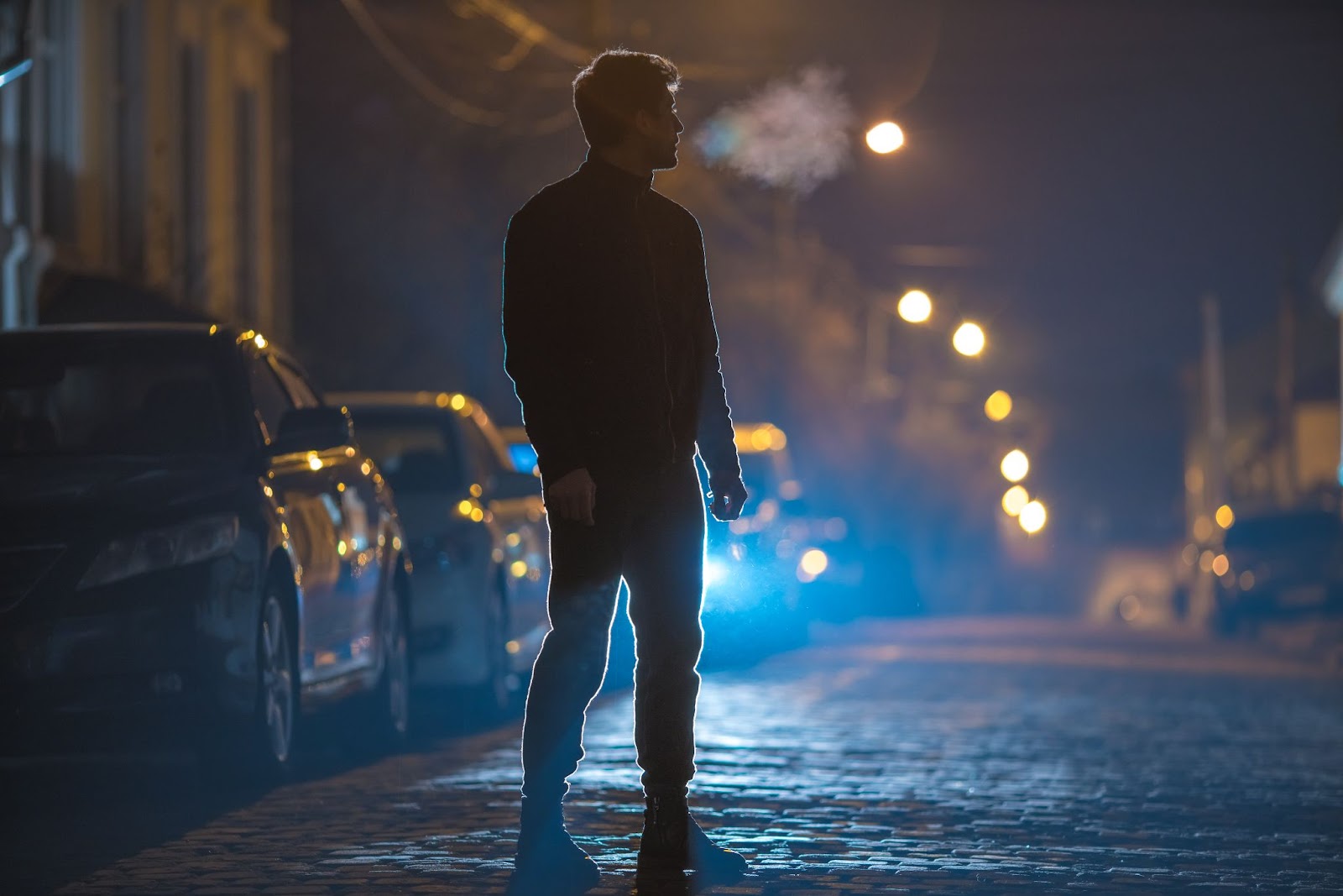 person standing on a dark street