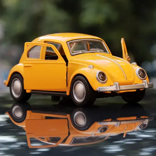 vintage-diecast-car-scale-model-resembling-volkswagen-beetle-yellow-minor