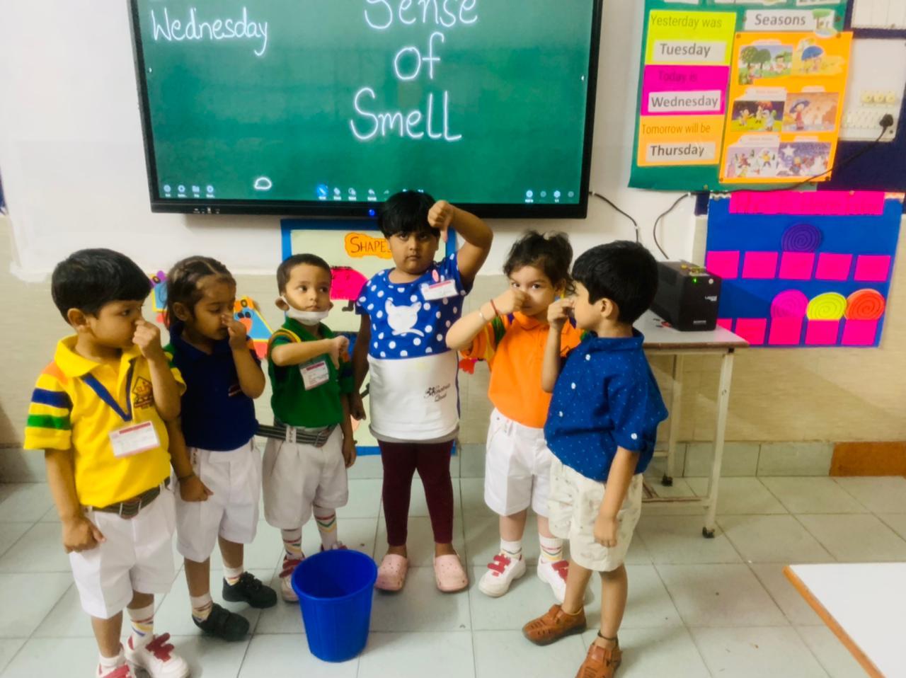 Students demonstrating a presentation through smartboards in classrooms