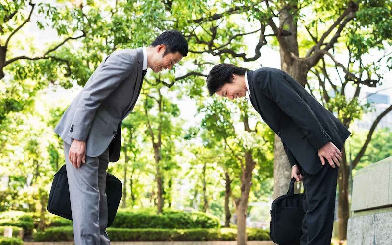 Japanese bowing to greet each other