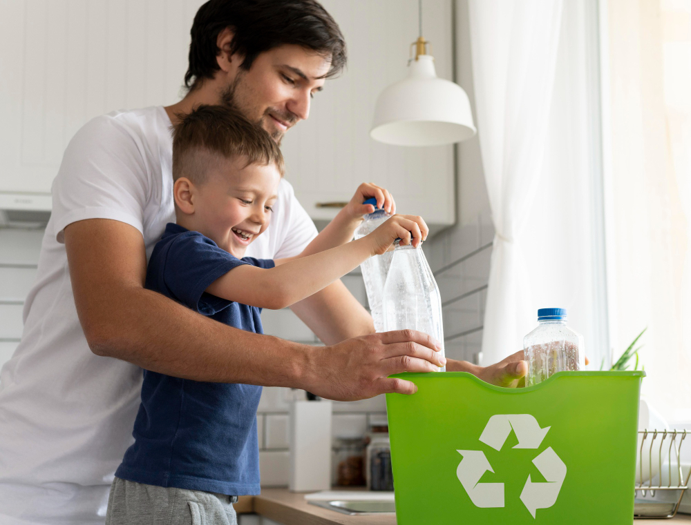 A father teaches his son how to properly recycle at home.