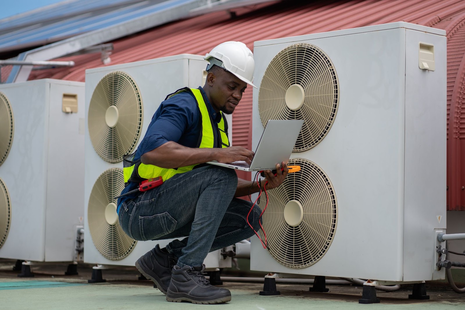 Professional servicing of an air conditioning system in a high-rise building.
