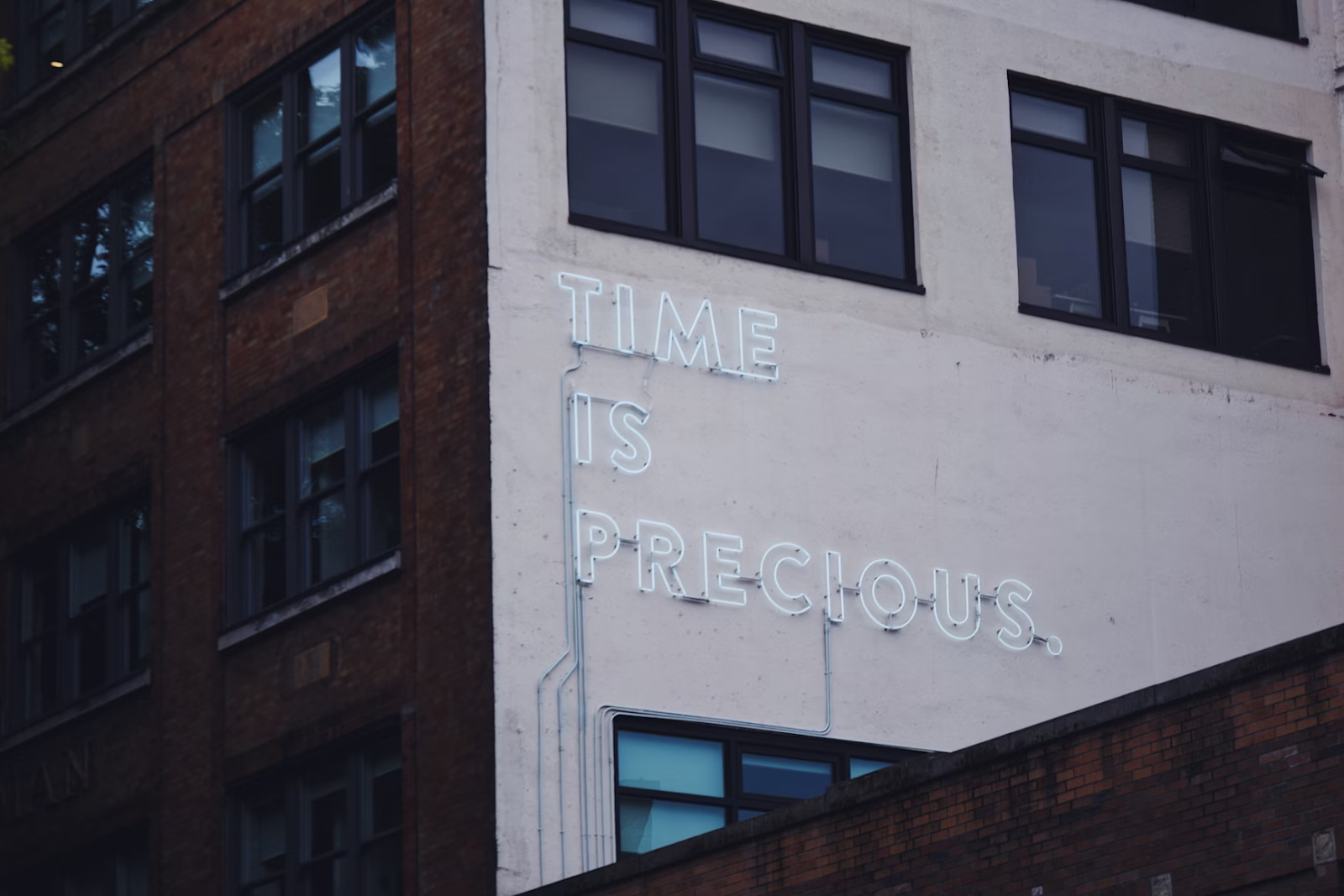 Neon sign saying Time Is Precious