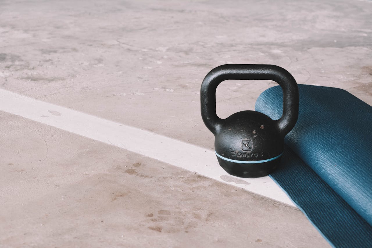 A kettlebell and yoga mat