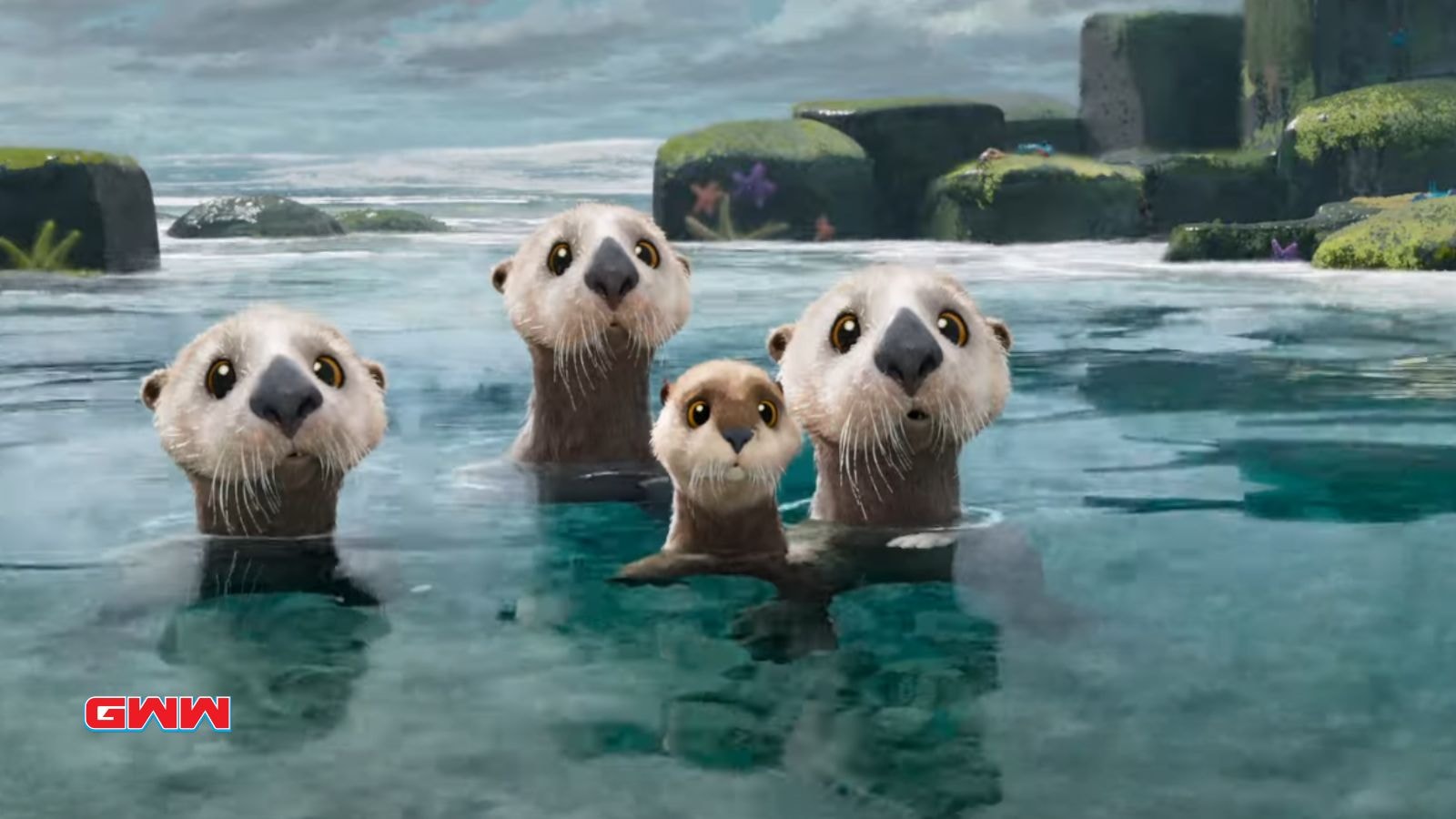 Four otters curiously looking towards the camera in a calm ocean.