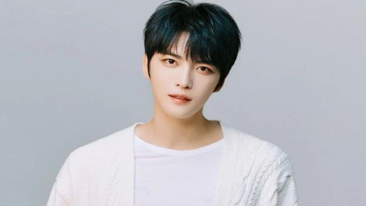 This is a picture of Kim Jaejoong wearing white shirt 