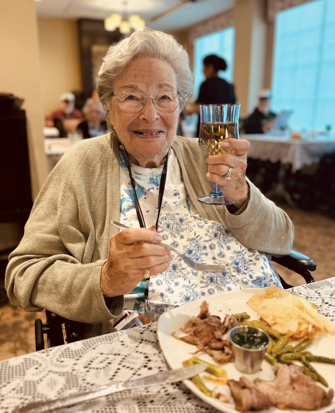 An assisted living resident eating a steak dinner