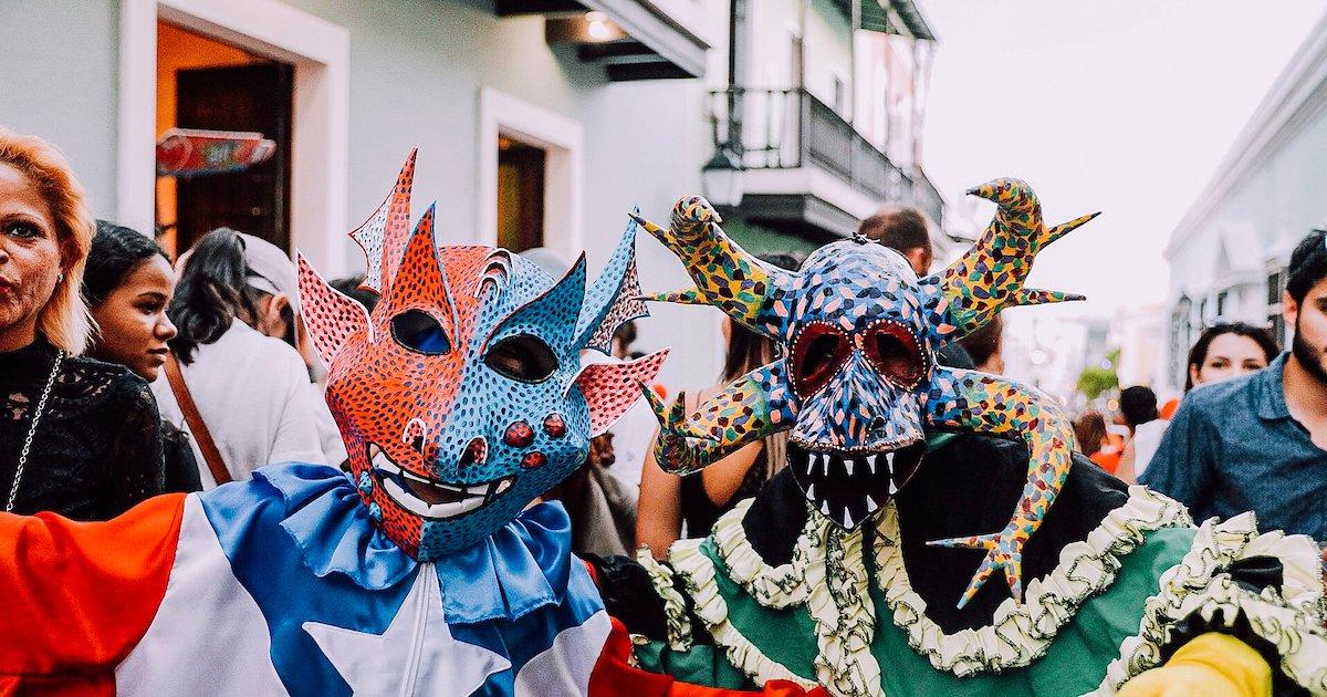 People wearing masks in a street

Description automatically generated