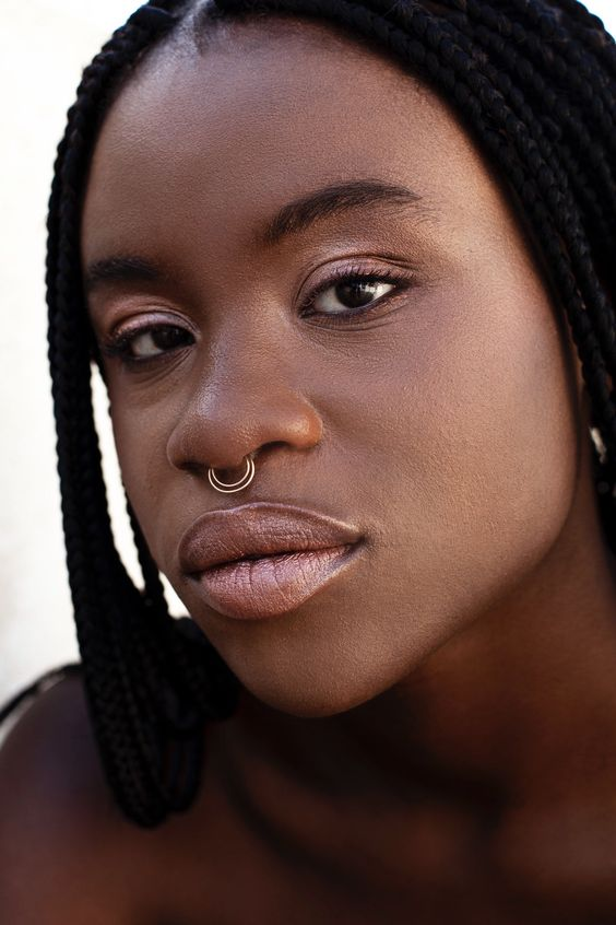 black girl wearing a septum piercing