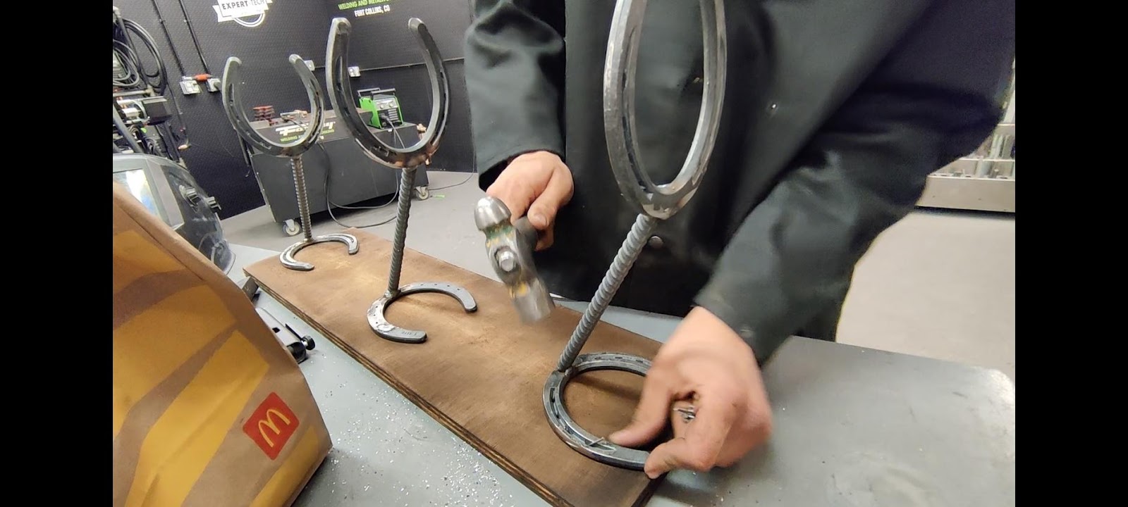 A picture containing person, scissors, indoor, tool

Description automatically generated
